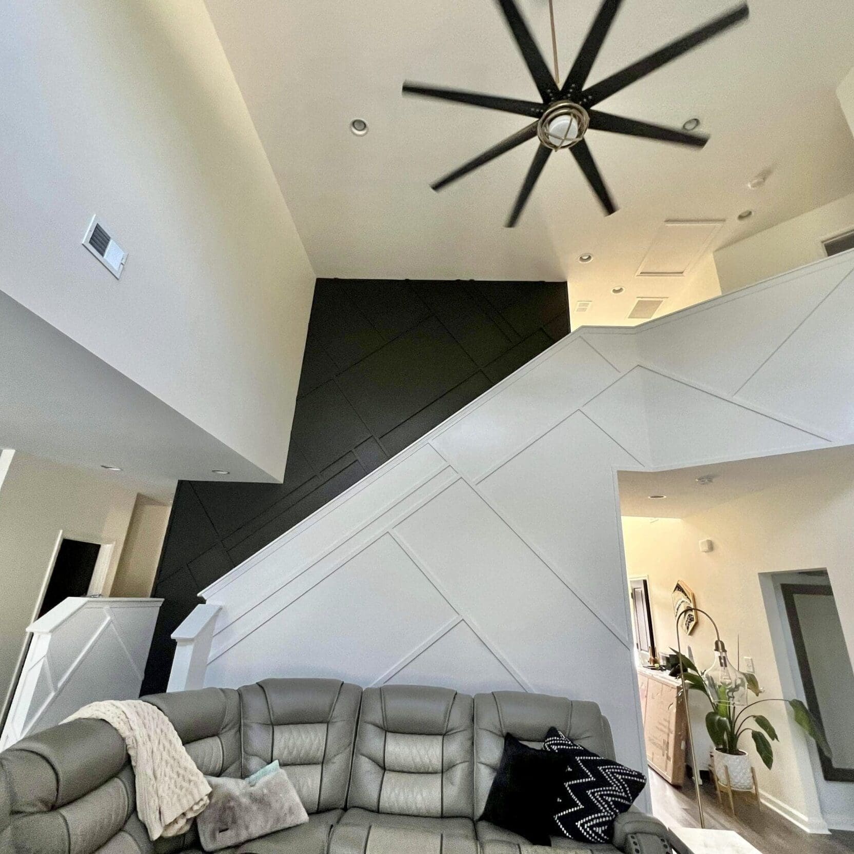 IMG_3388 room with modern staircase and ceiling fan